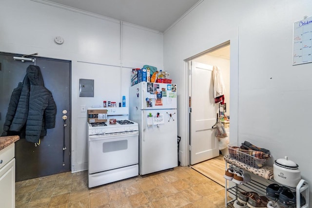 kitchen featuring white cabinetry, white appliances, and ornamental molding