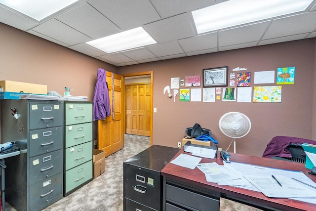 home office with a paneled ceiling