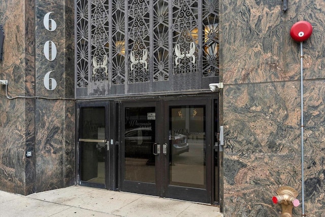 property entrance with french doors and a balcony