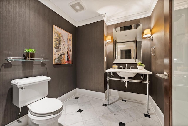 bathroom with toilet and crown molding