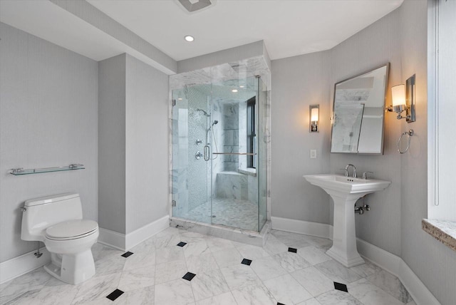 bathroom featuring toilet and walk in shower
