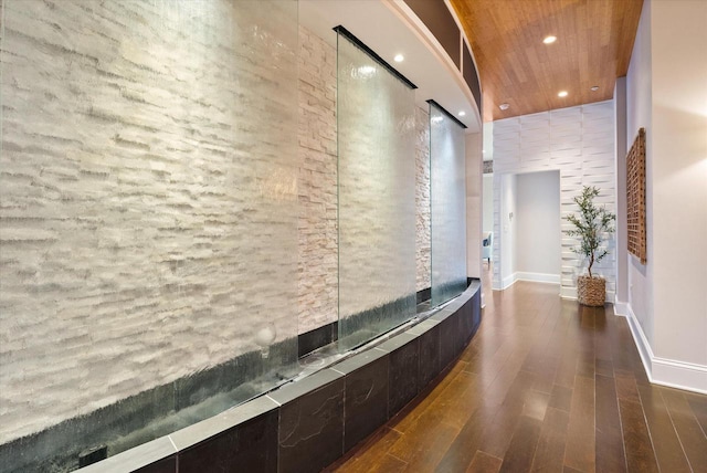 hall with dark hardwood / wood-style flooring