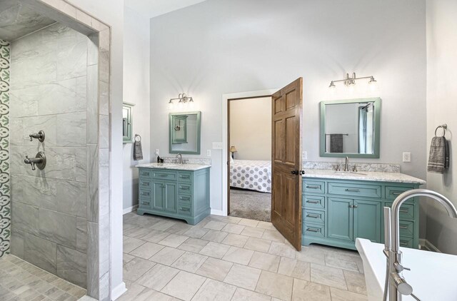 7134 N Tichigan Rd, Waterford, WI 53185 - bathroom featuring two vanities and a tile shower