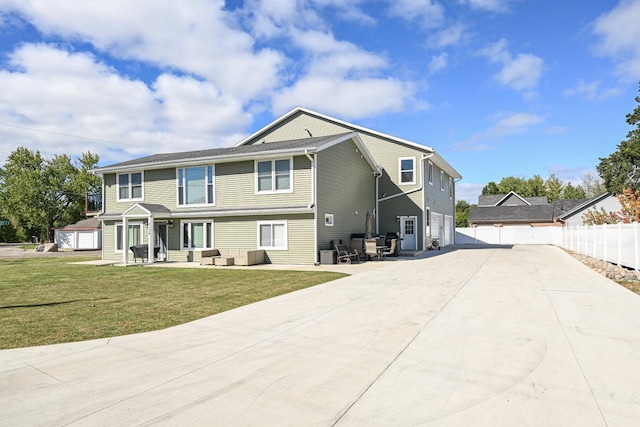 7134 N Tichigan Rd, Waterford, WI 53185 - view of front of property featuring an outdoor hangout area, driveway, a garage, and a patio