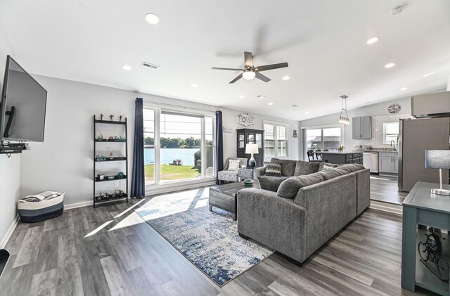 7134 N Tichigan Rd, Waterford, WI 53185 - living room featuring a ceiling fan, plenty of natural light, dark wood finished floors, recessed lighting, and baseboards