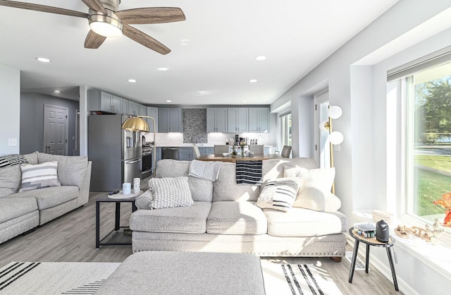 7134 N Tichigan Rd, Waterford, WI 53185 - living area featuring healthy amount of natural light, light wood-style floors, recessed lighting, and a ceiling fan
