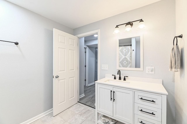 7134 N Tichigan Rd, Waterford, WI 53185 - full bathroom featuring vanity and baseboards