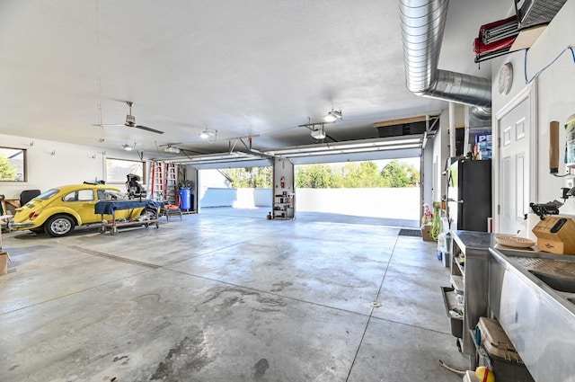 7134 N Tichigan Rd, Waterford, WI 53185 - garage featuring a garage door opener
