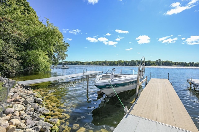7134 N Tichigan Rd, Waterford, WI 53185 - dock featuring a water view and boat lift