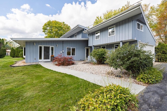 4705 Highland Park Dr, Slinger, WI 53086 - rear view of property with a yard