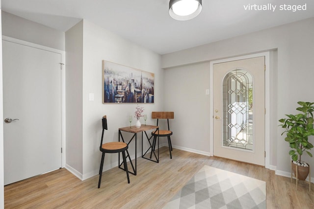 foyer entrance with light wood-type flooring