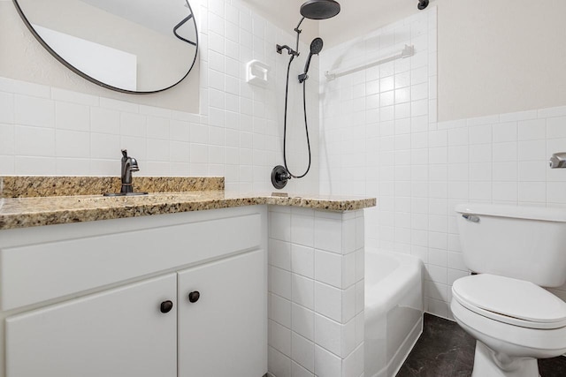 full bathroom featuring vanity, toilet, tile walls, and tiled shower / bath combo