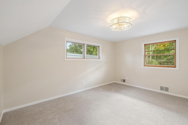 bonus room with carpet and vaulted ceiling