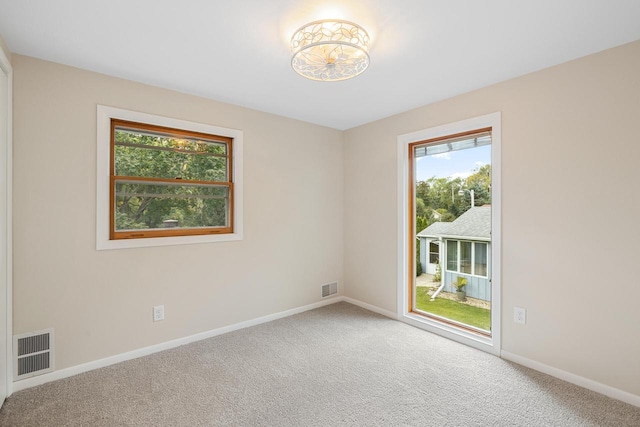 4705 Highland Park Dr, Slinger, WI 53086 - carpeted empty room with healthy amount of natural light and baseboards