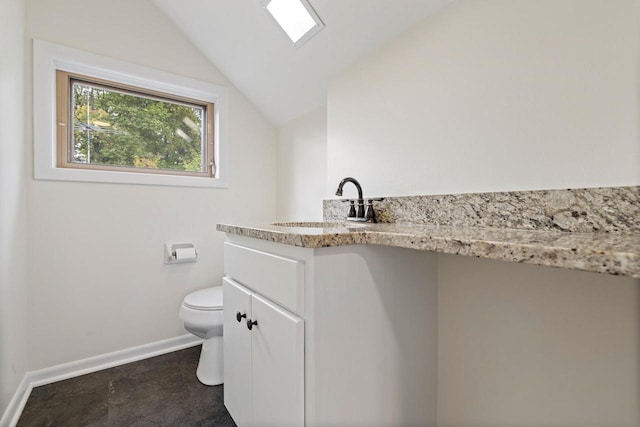 4705 Highland Park Dr, Slinger, WI 53086 - bathroom with lofted ceiling, toilet, baseboards, and vanity