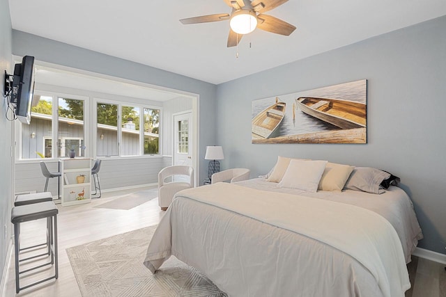 bedroom featuring light hardwood / wood-style floors and ceiling fan