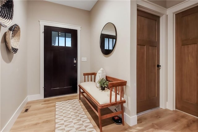 foyer with light hardwood / wood-style floors