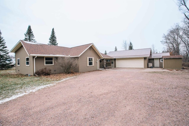 ranch-style home featuring a garage