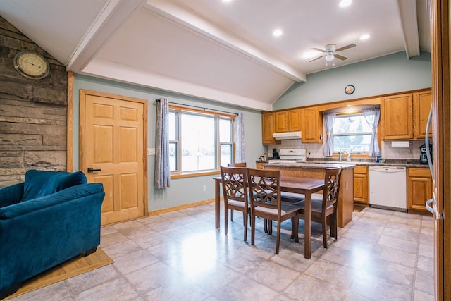 kitchen featuring white appliances, sink, vaulted ceiling with beams, ceiling fan, and tasteful backsplash