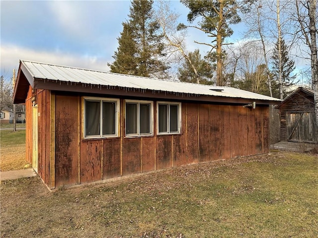 view of home's exterior with a storage shed