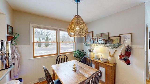 dining area with hardwood / wood-style flooring