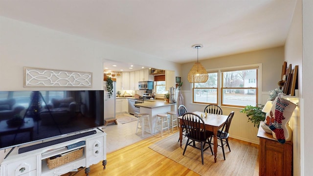 dining room featuring light wood-type flooring