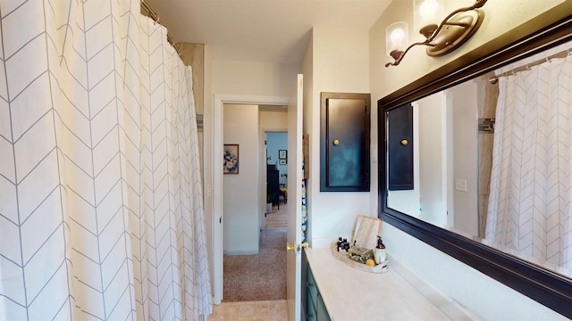 bathroom featuring tile patterned flooring and vanity