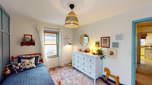 bedroom featuring light colored carpet
