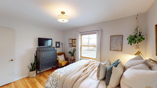 bedroom with light hardwood / wood-style flooring