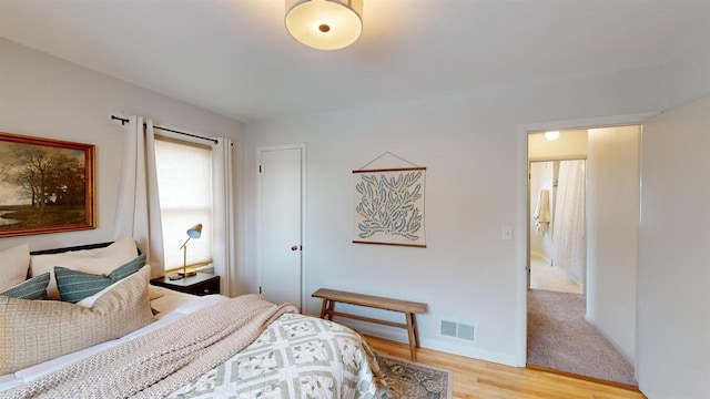 bedroom with light hardwood / wood-style floors