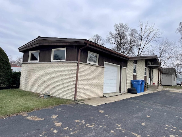 view of side of home with a garage