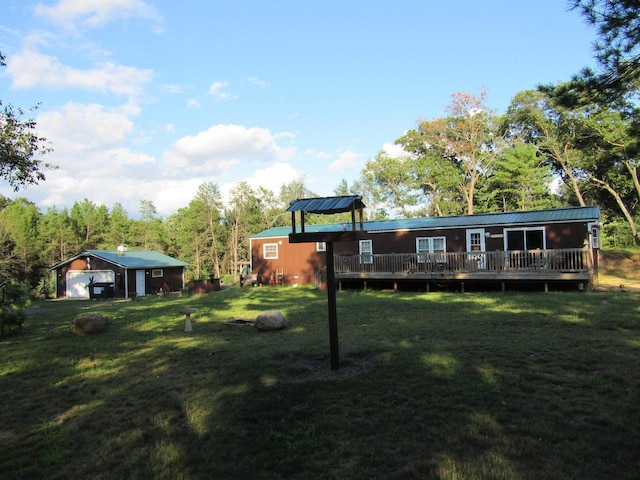 view of yard featuring a wooden deck and an outdoor structure