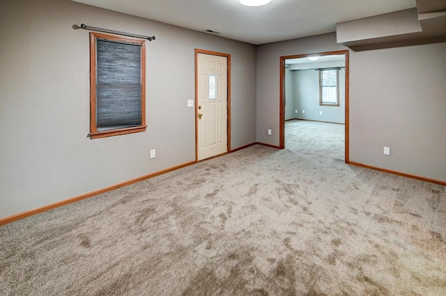 view of carpeted entrance foyer