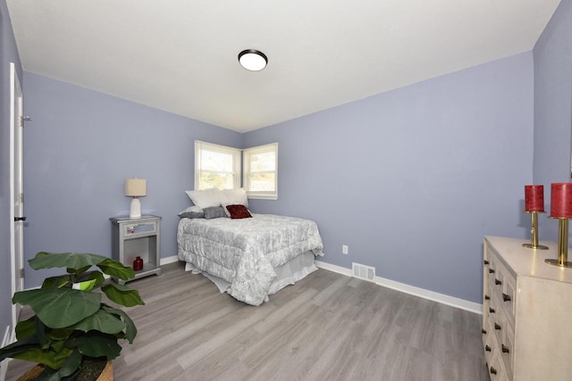 bedroom with light hardwood / wood-style flooring