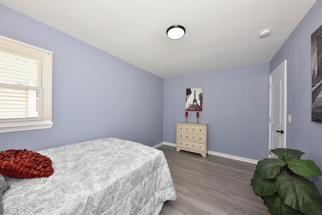 bedroom with hardwood / wood-style floors