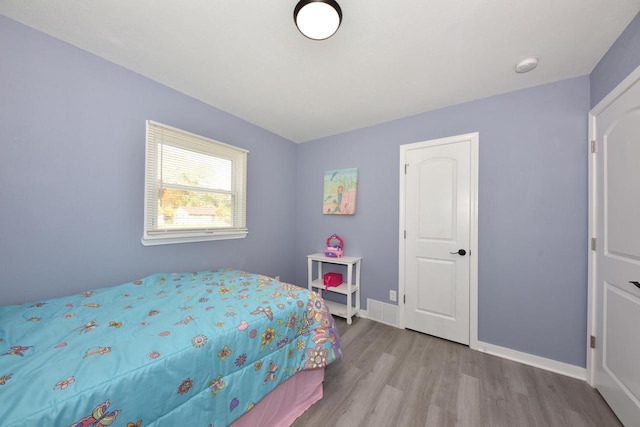 bedroom featuring light wood-type flooring