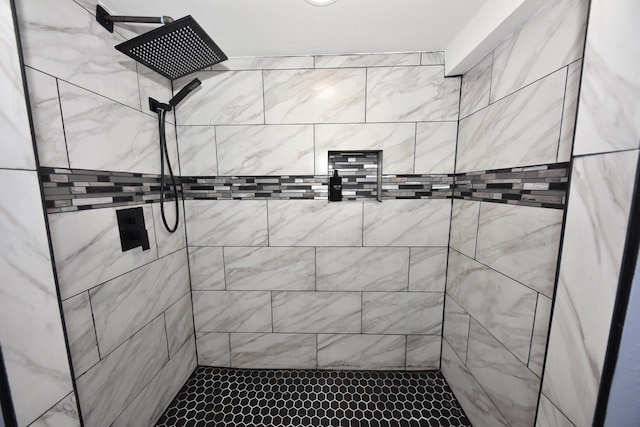 bathroom with tiled shower