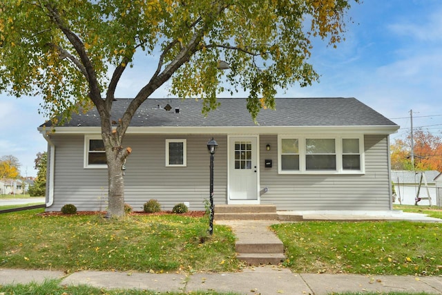 ranch-style house with a front yard