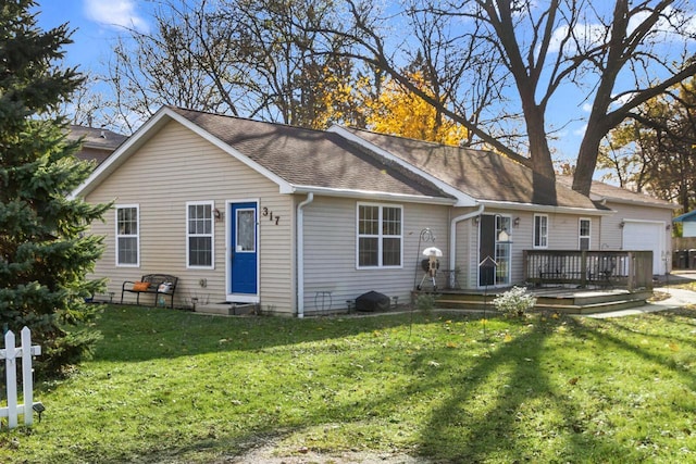 back of house with a yard and a wooden deck