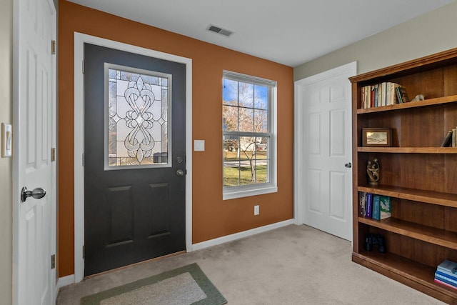 entrance foyer featuring light carpet