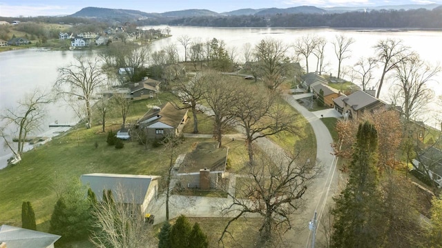 drone / aerial view featuring a water and mountain view