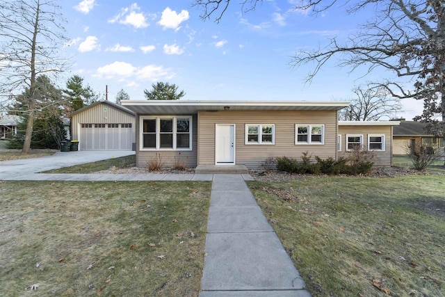 ranch-style home featuring a garage and a front yard