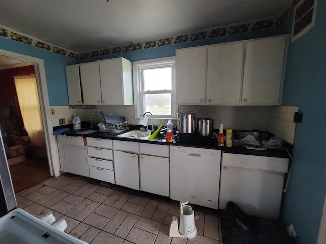 kitchen with decorative backsplash, white cabinetry, dishwasher, and sink