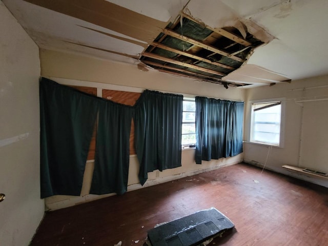 spare room featuring dark wood-type flooring