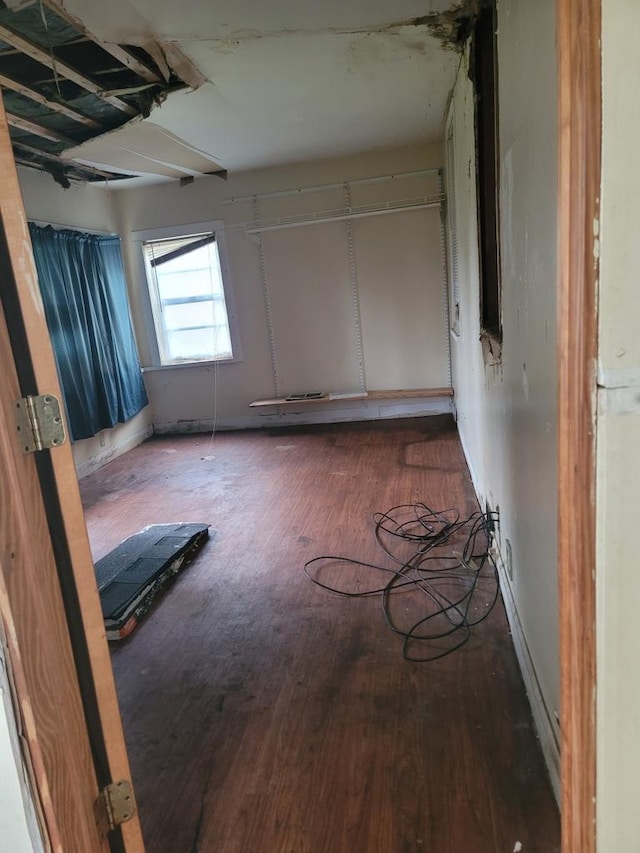 unfurnished bedroom featuring dark hardwood / wood-style floors