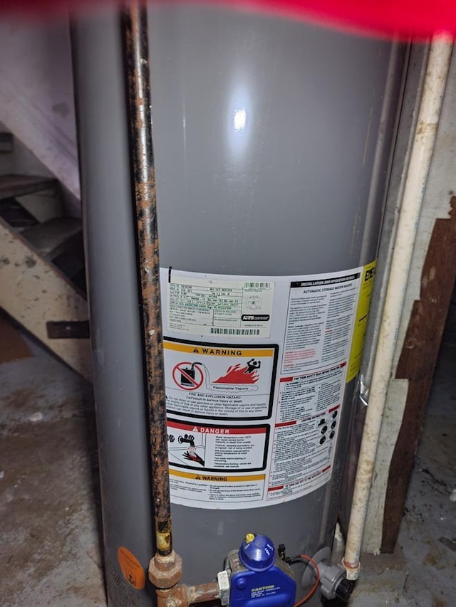 utility room with water heater