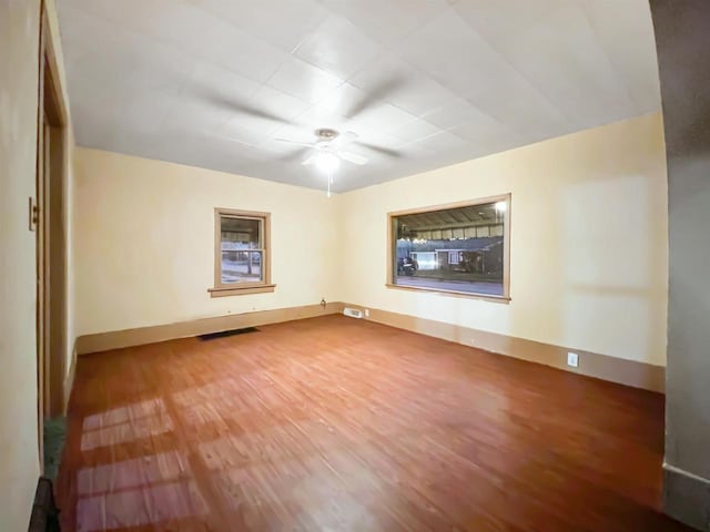 spare room featuring hardwood / wood-style flooring and ceiling fan