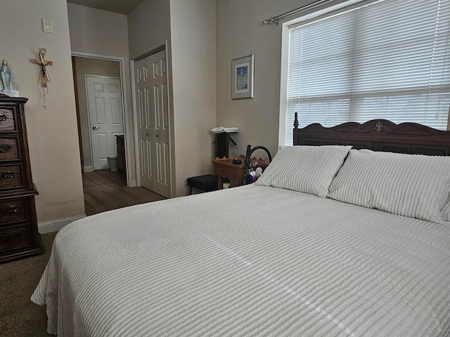 bedroom with dark carpet