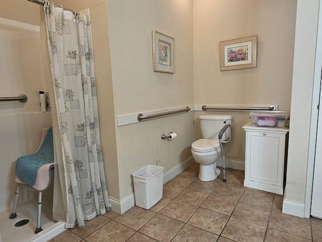 bathroom featuring tile patterned floors, walk in shower, and toilet