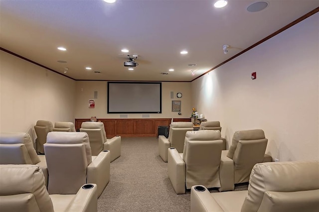 cinema featuring light carpet and ornamental molding